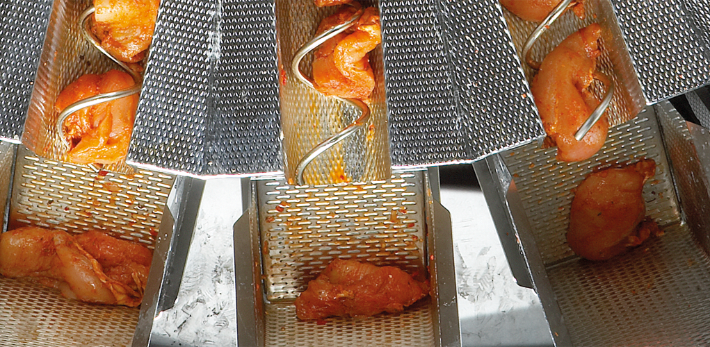 Screwfeed marinade chicken close up